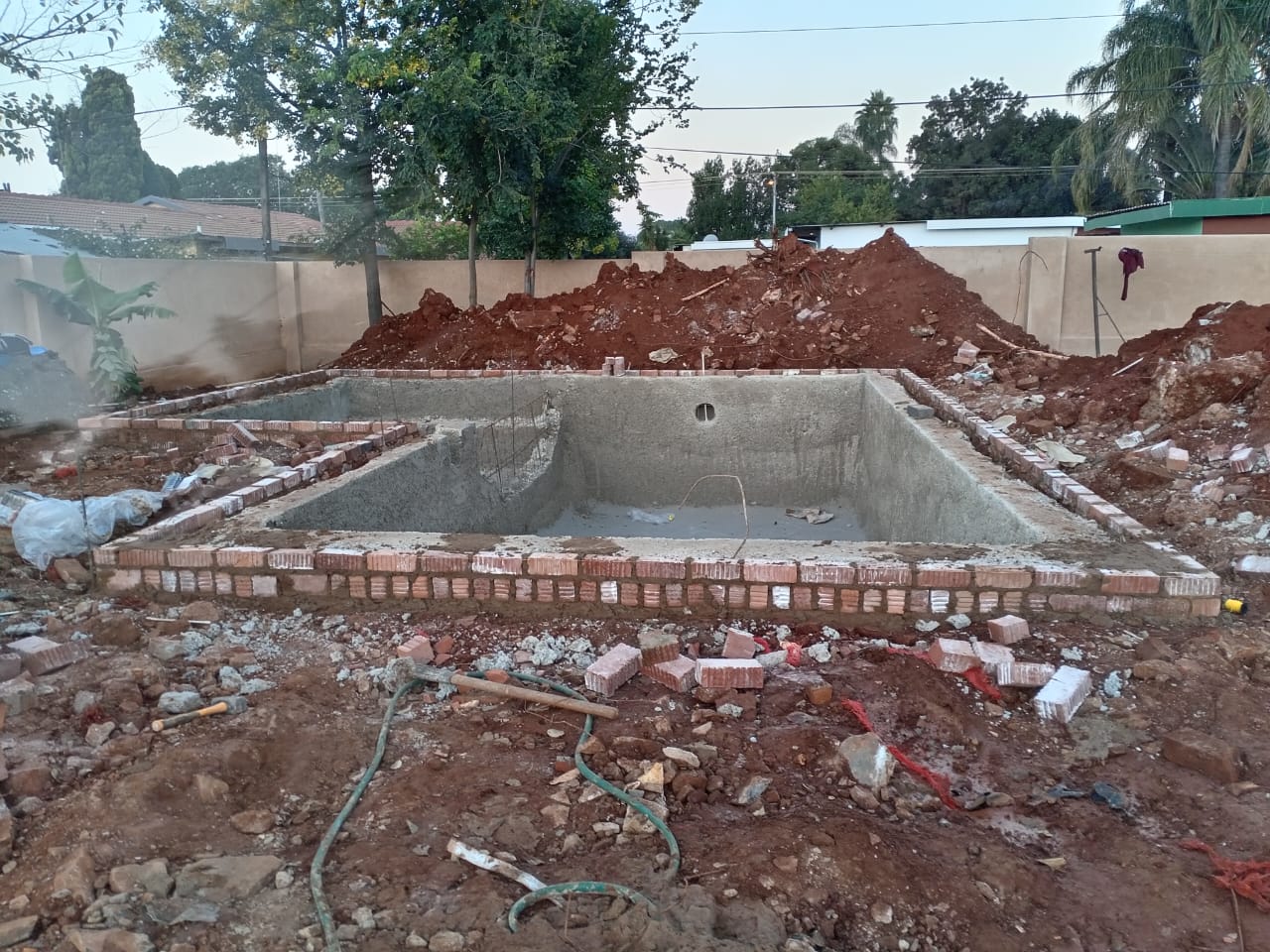 Pool installation process by Carlos Pools